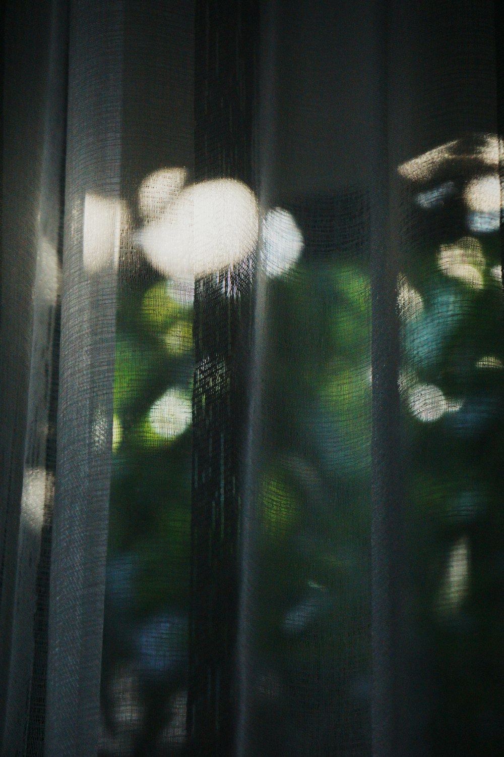 white round ornament on glass window