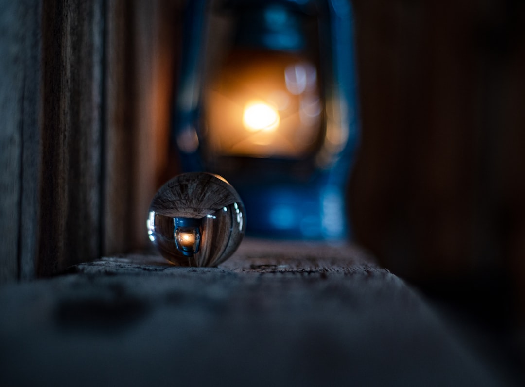 silver round ring on brown wooden surface