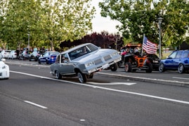blue and white chevrolet camaro on road during daytime