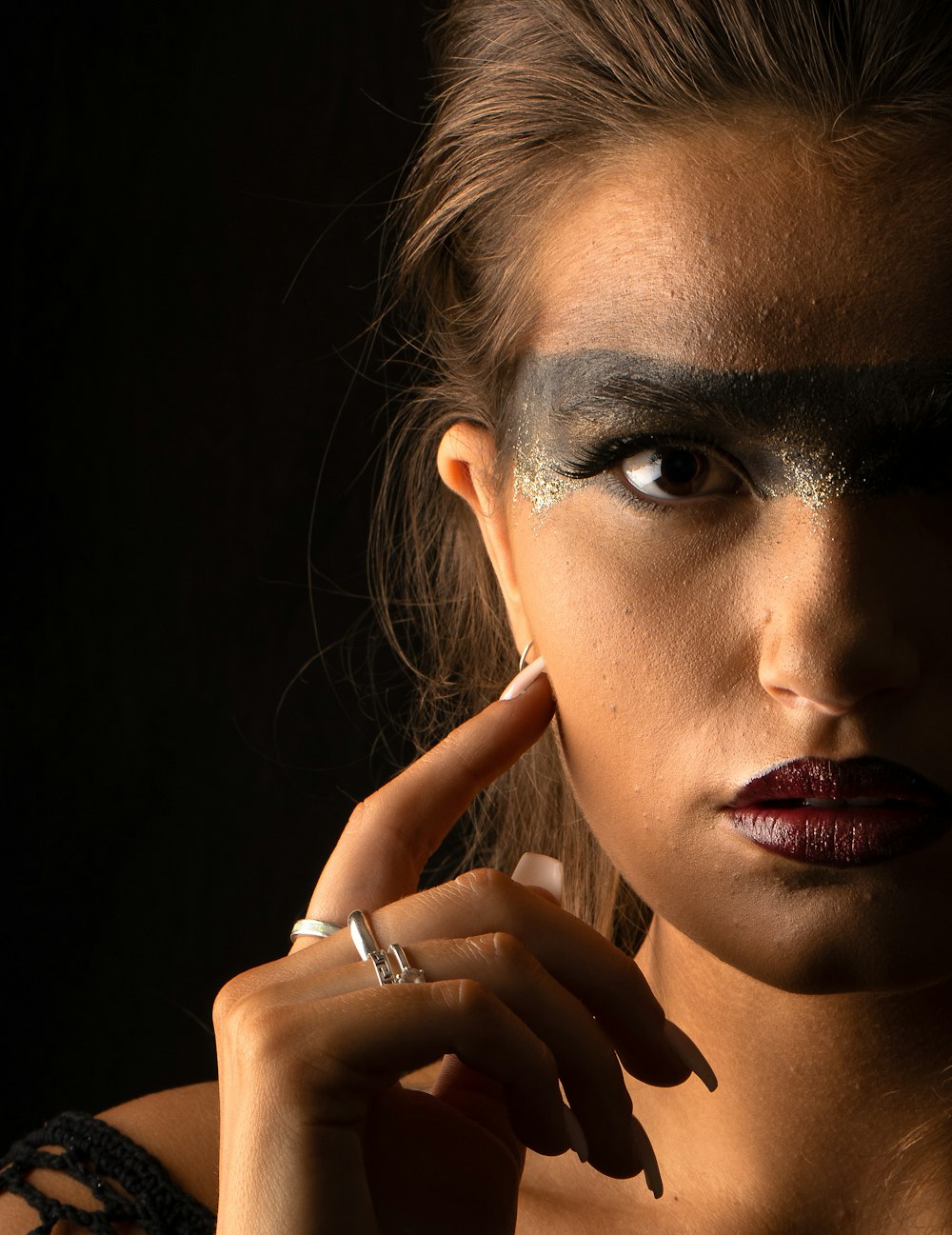 woman with red lipstick and black mascara