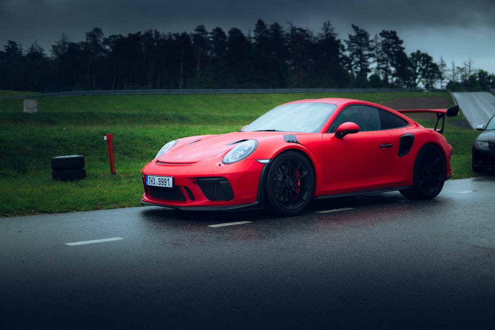 red porsche 911 on road during night time