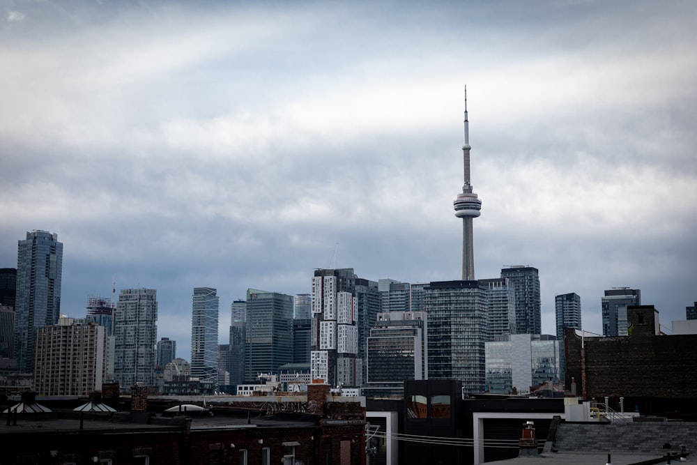 city skyline under white clouds during daytime