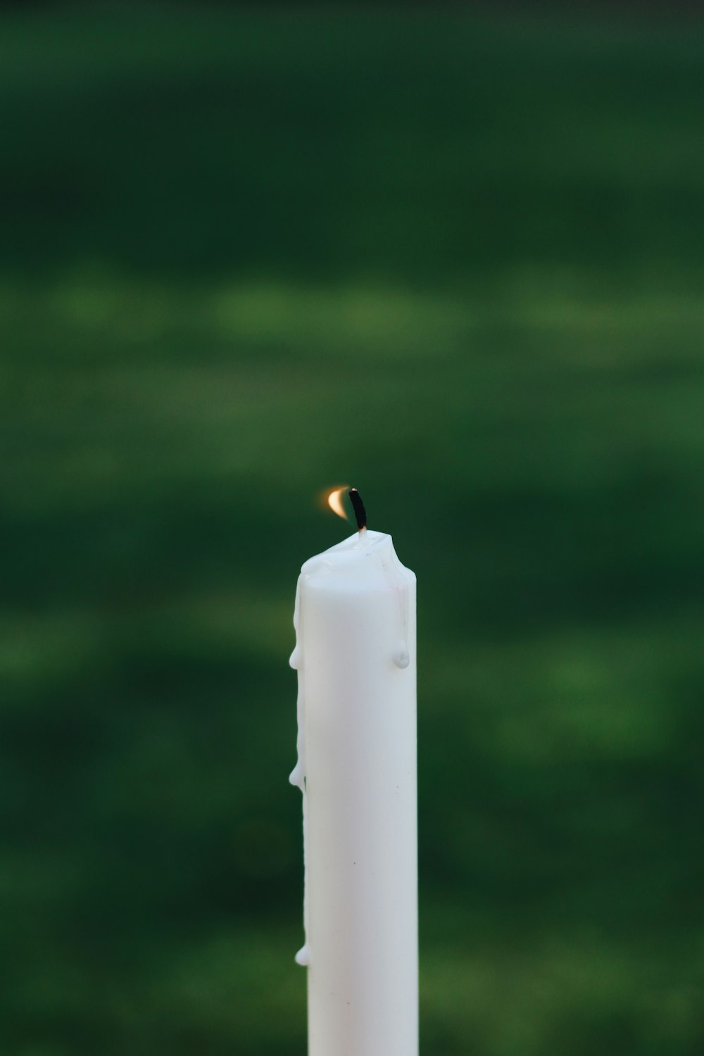 white candle in tilt shift lens