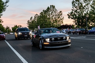 black bmw car on road during daytime