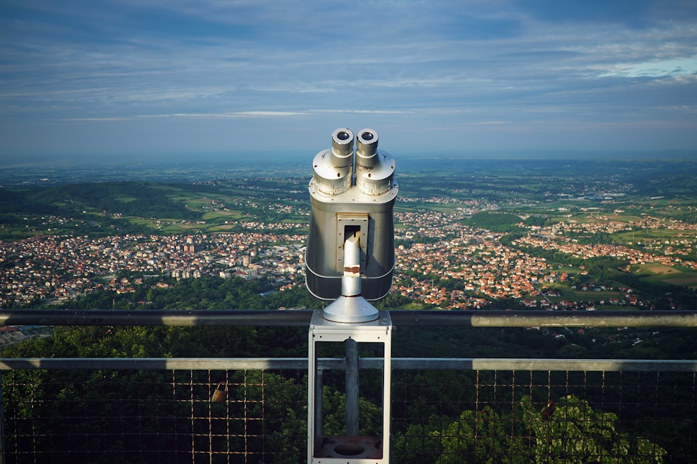 gray binoculars on top of the building