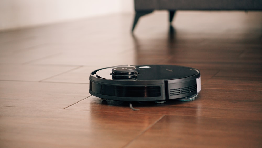 black camera lens on brown wooden table