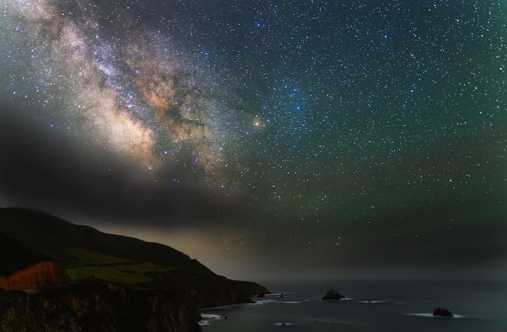 body of water under starry night