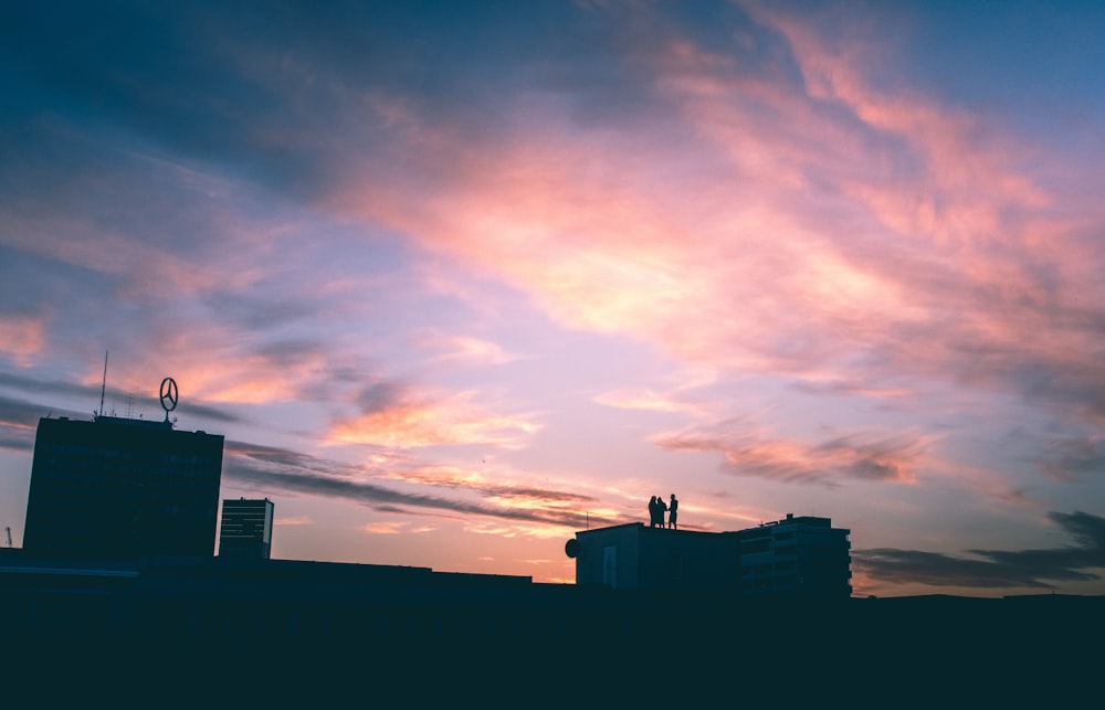 silhouette of building during sunset