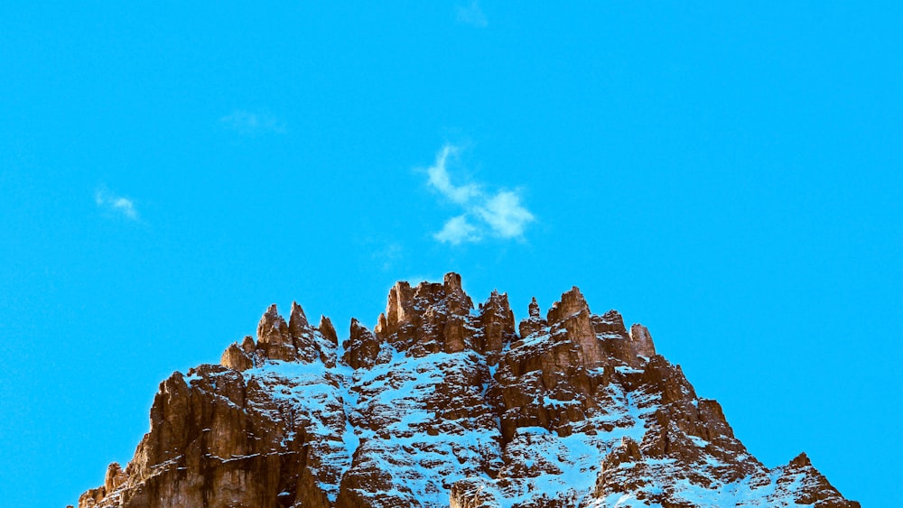 brown rocky mountain under blue sky during daytime