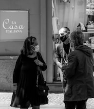 Students engaged in a lively Italian conversation class with a native-speaking teacher.