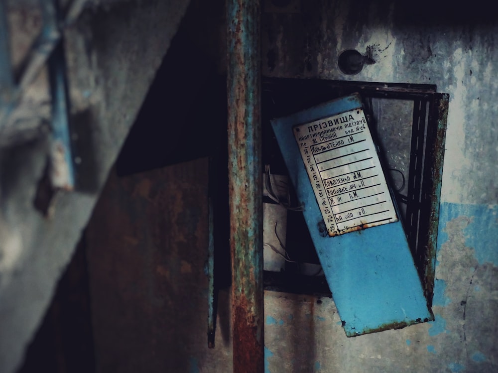 blue and white box on brown wooden wall