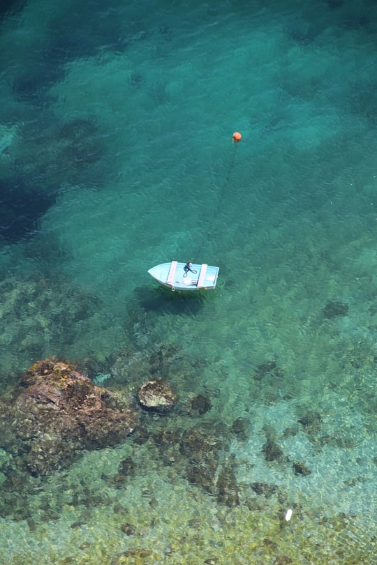 white boat on body of water during daytime in Amalfi Italy