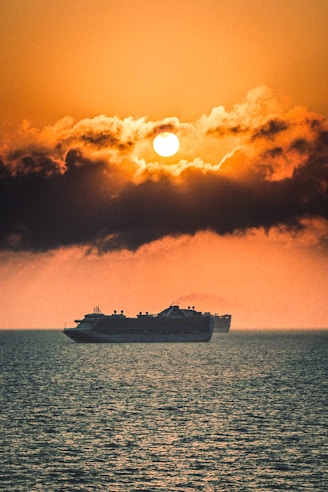 white ship on sea under blue sky during daytime