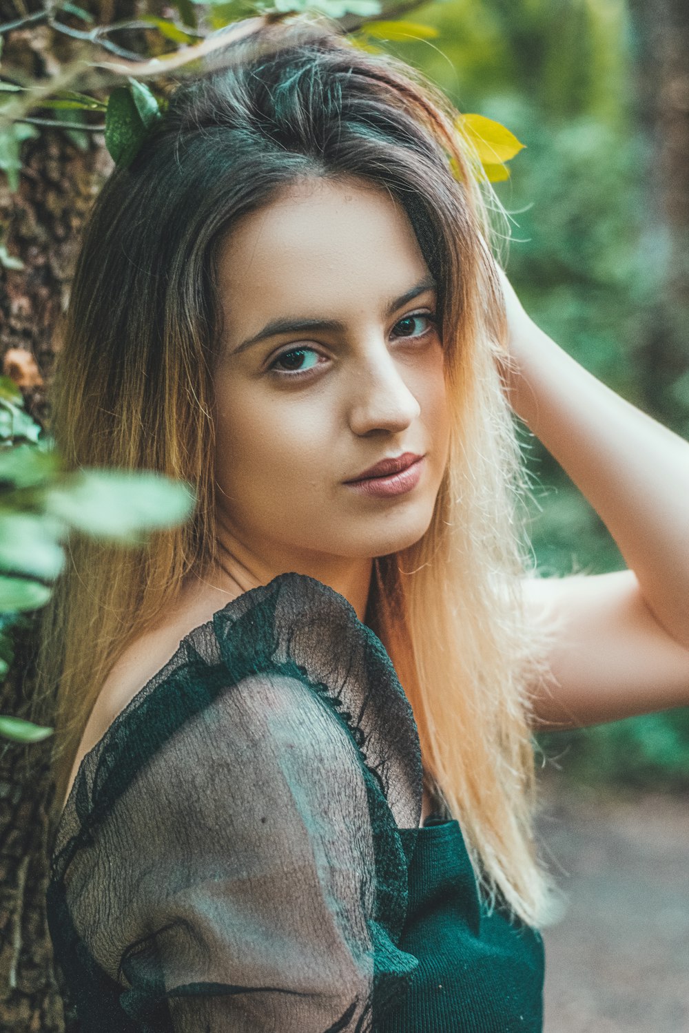 woman in green sleeveless top