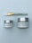 A skincare set featuring two jars and a brush. One jar is a 50ml moisturizer and the other is a 100ml clay mask, both labeled with 'YAMCO SKIN #NOFILTER'. The brush has a green handle with a gold ferrule and soft white bristles.