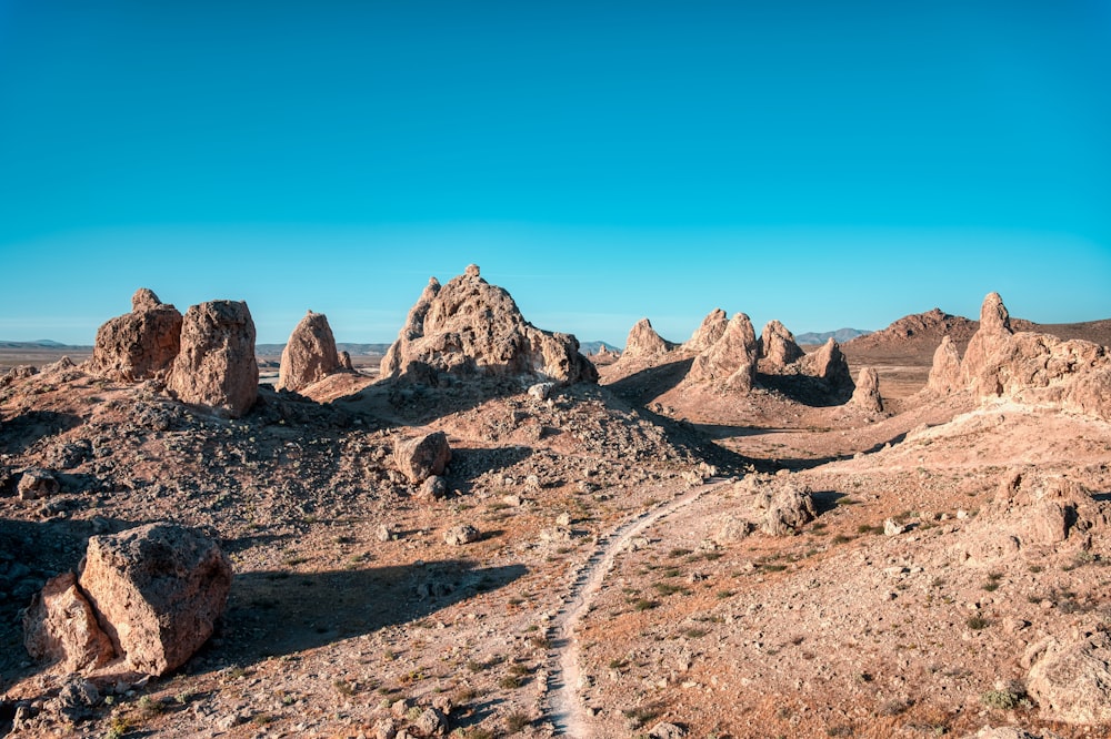 brown rocky mountain under blue sky during daytime