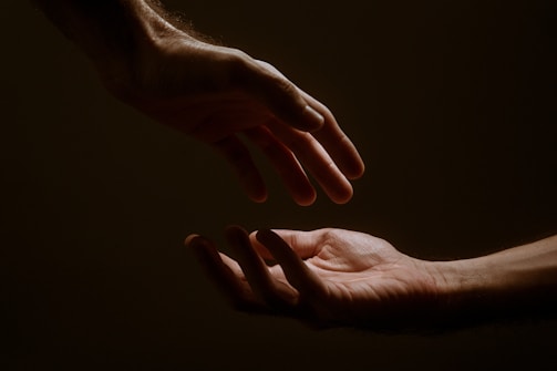 persons hand forming heart