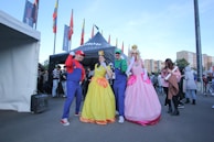 Funny in-game moment with players dressed in colorful Minecraft skins.