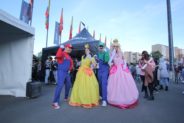 A vibrant convention scene with fans dressed as iconic video game and movie characters.