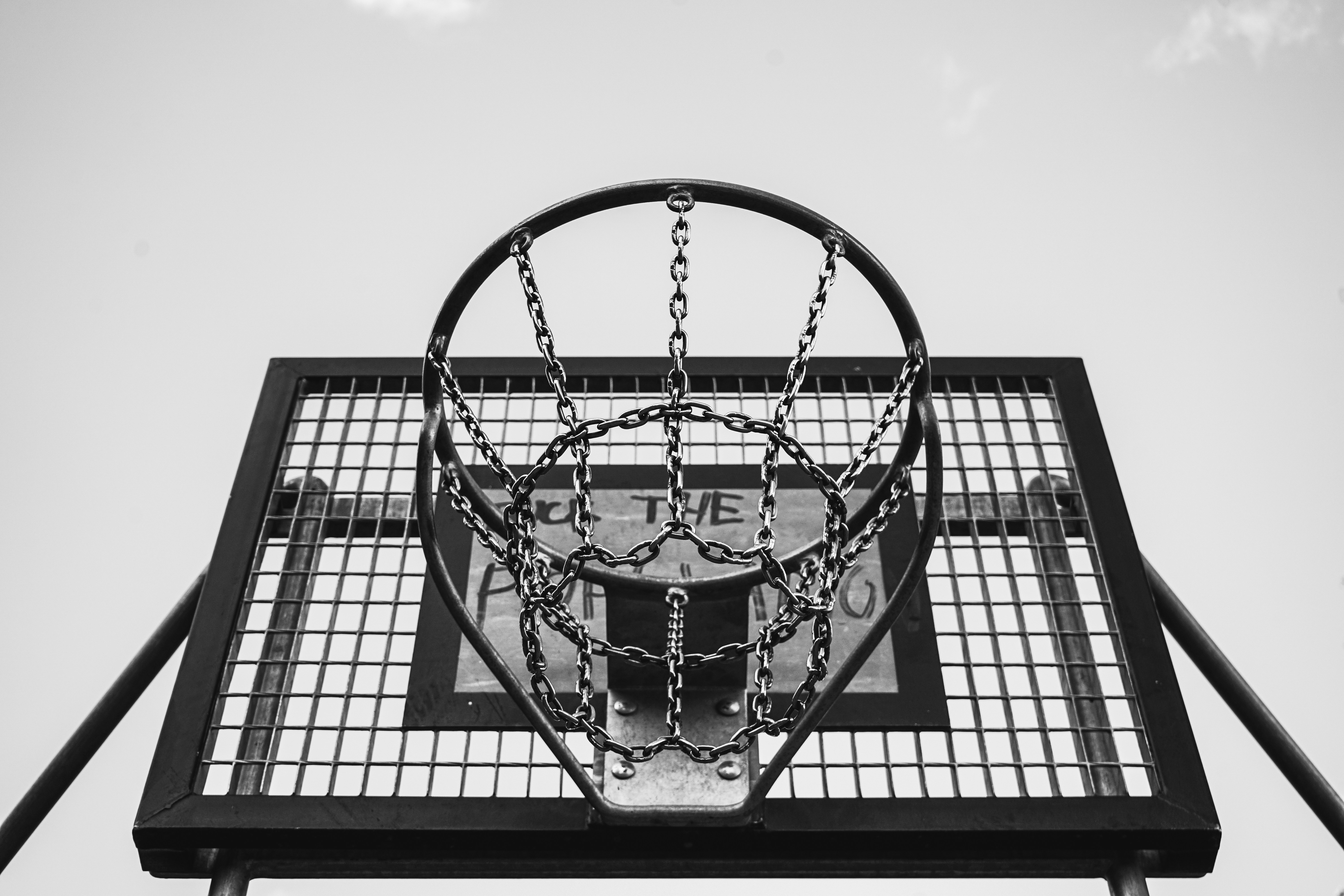 grayscale photo of basketball hoop