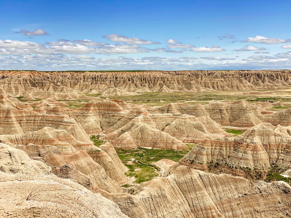 brown and green mountains under blue sky during daytime