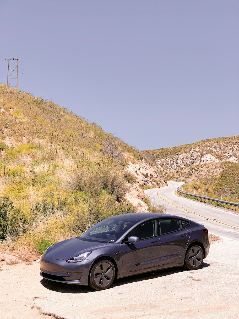 black sedan on road during daytime