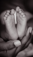 persons feet on black background
