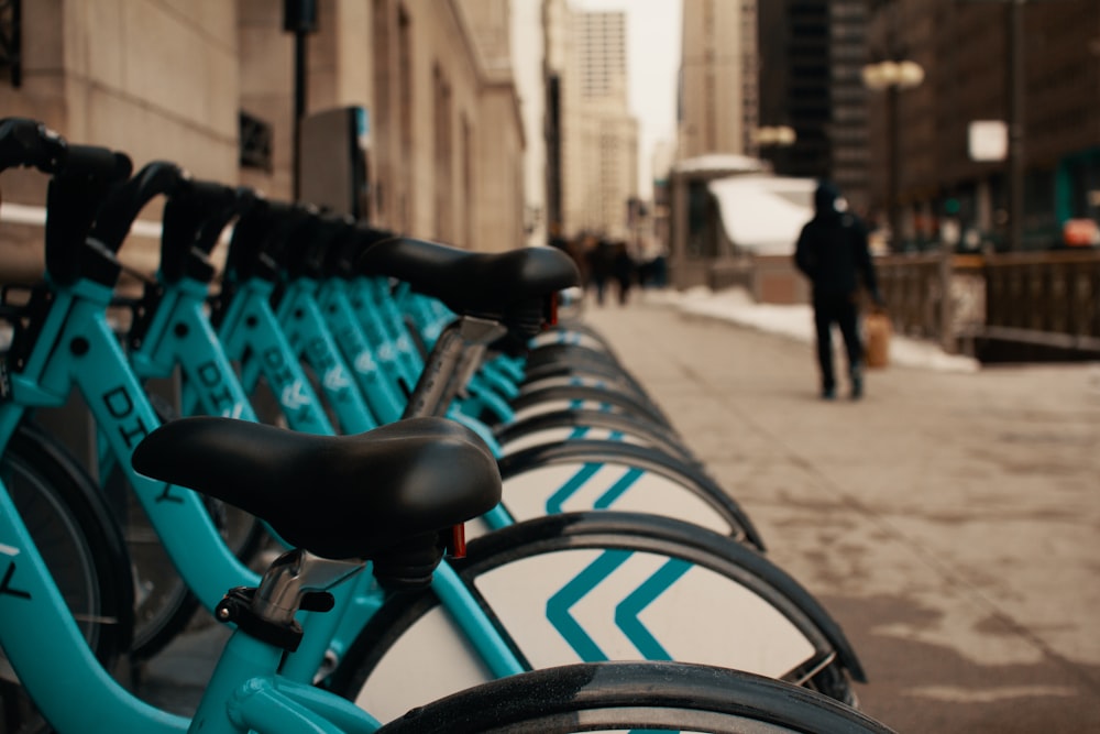 blue and black bicycle on road during daytime