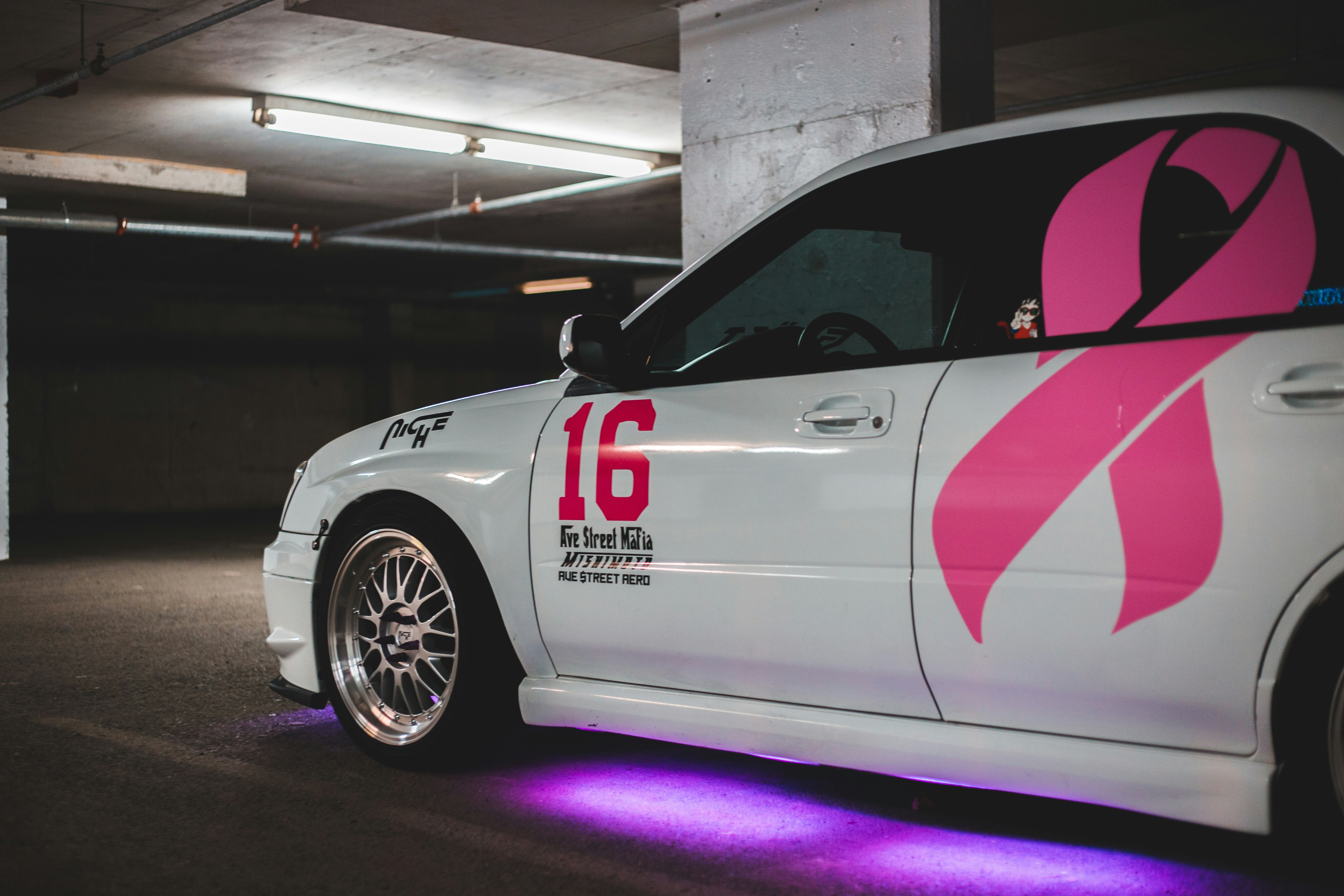 white and red car in a garage