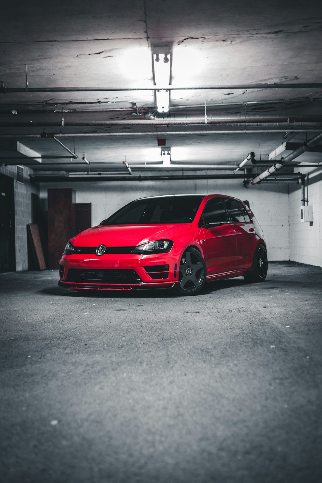 red car parked in garage