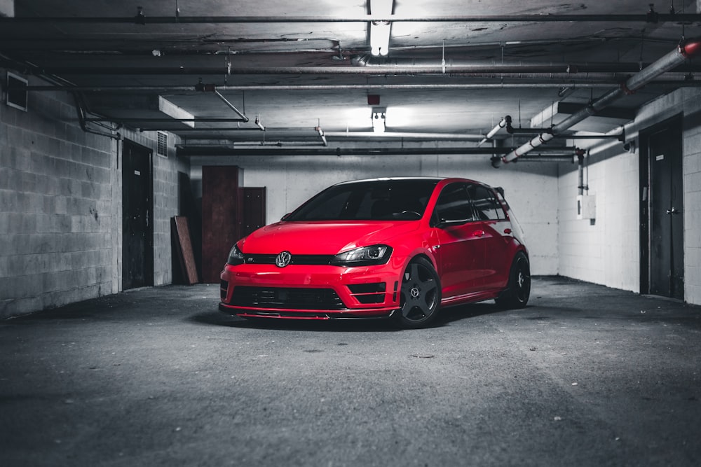 red car parked in garage