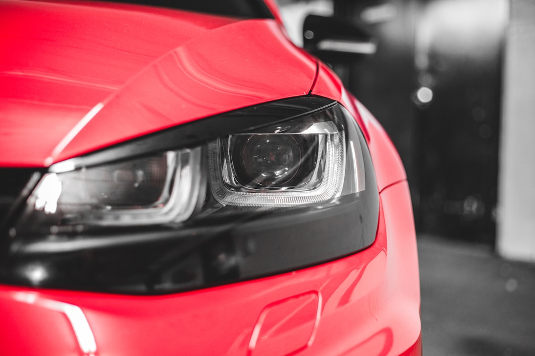 red car in close up photography