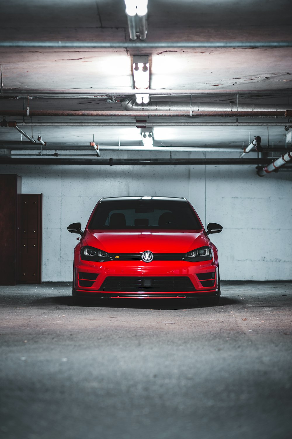 red bmw m 3 parked in garage