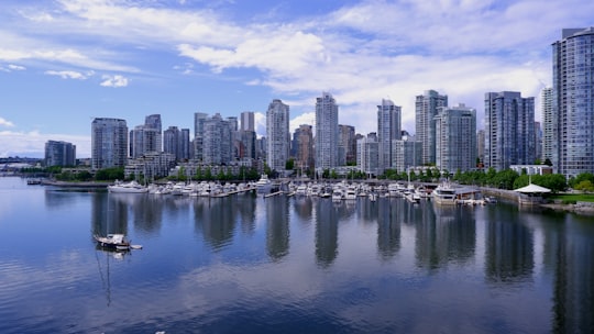 city skyline under blue sky and white clouds during daytime in Coopers' Park Canada