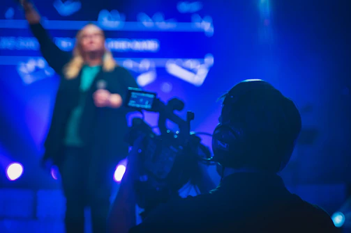 man in black shirt holding microphone