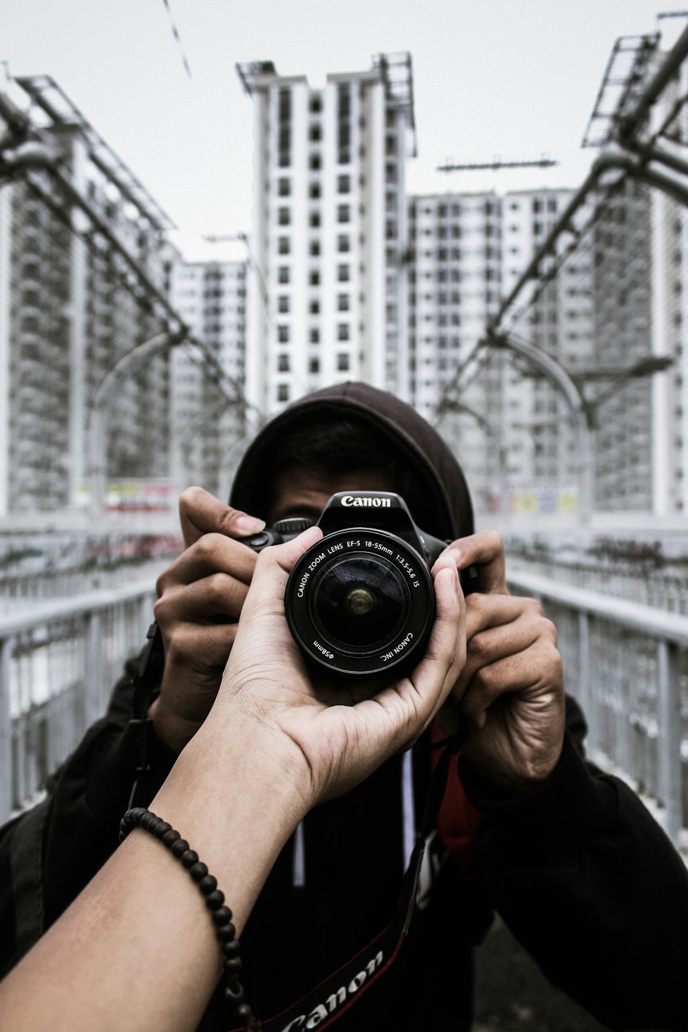 person holding black nikon dslr camera