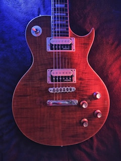 red and black electric guitar
