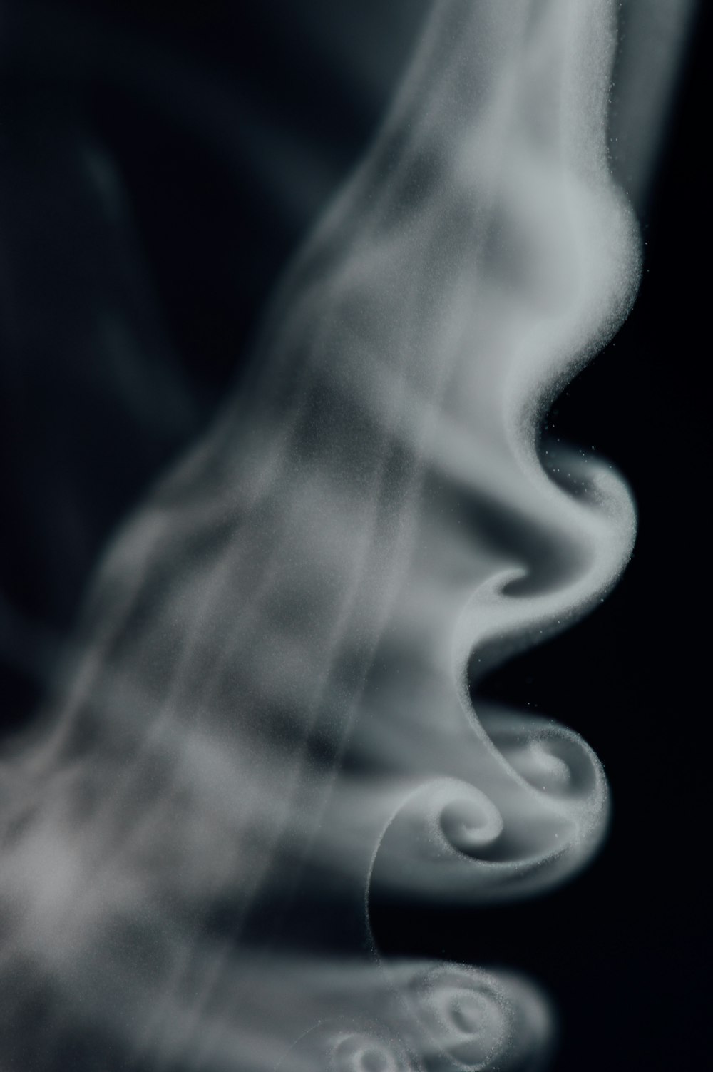 white smoke in black background