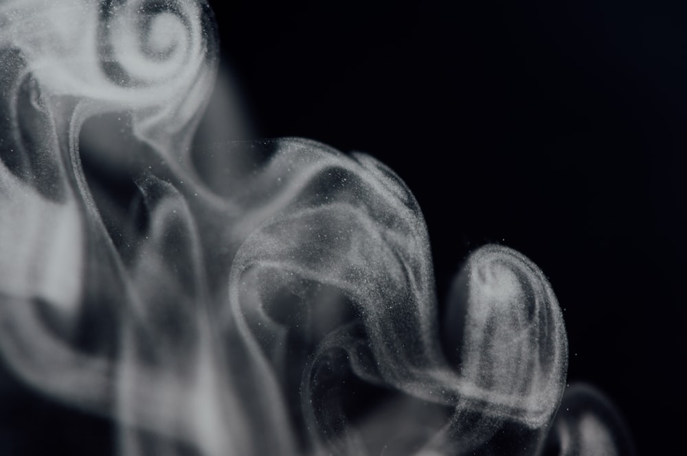 white smoke in black background