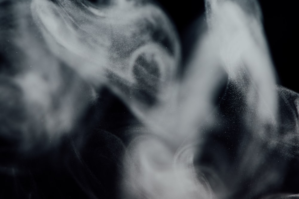 white smoke in black background