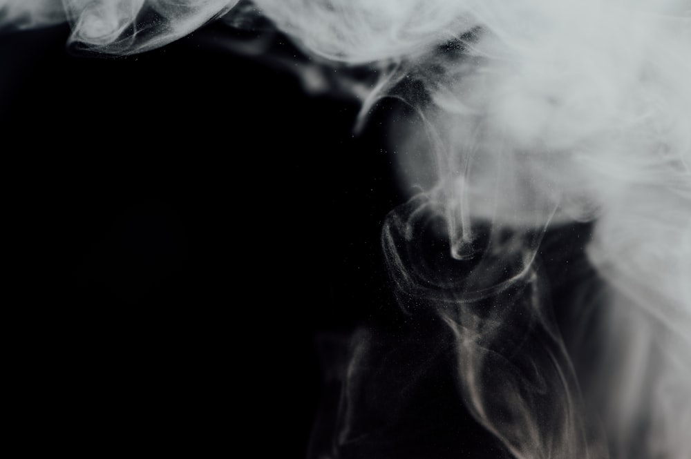 white smoke in black background