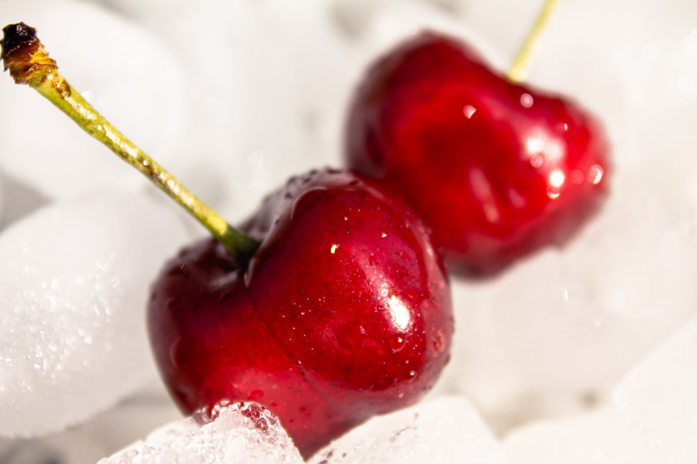 red cherry fruit on white textile