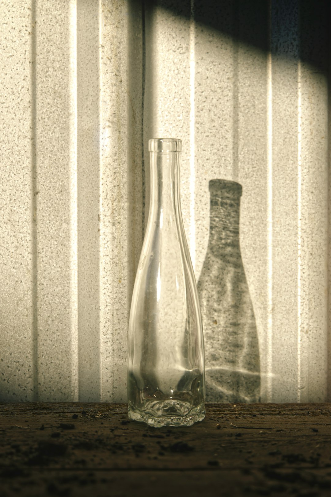 grayscale photo of glass bottle