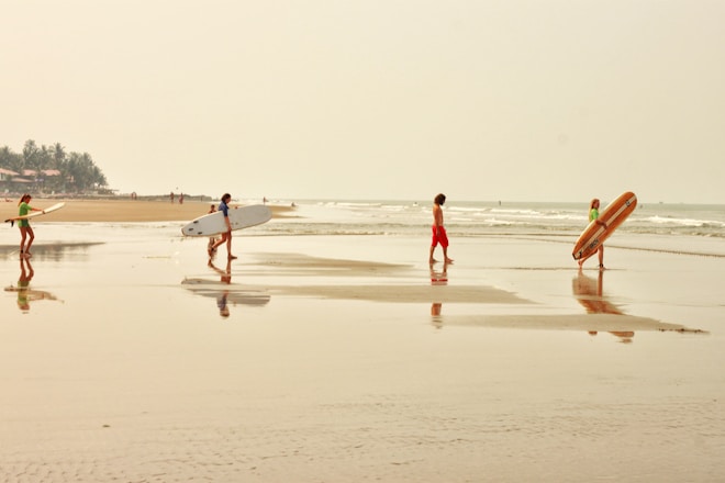 people walking on beach during daytime