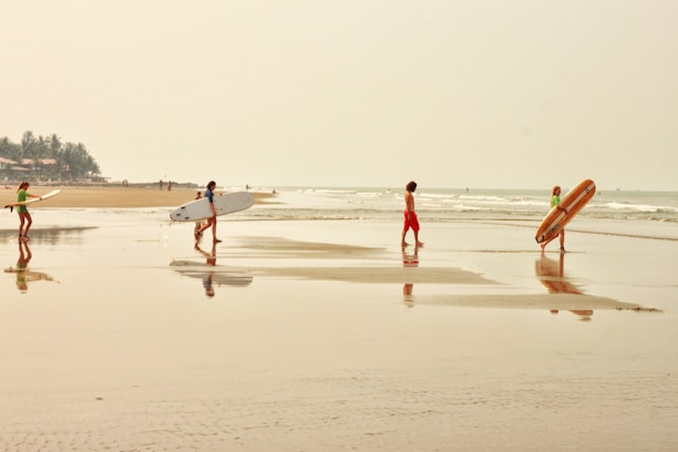 people walking on beach during daytime