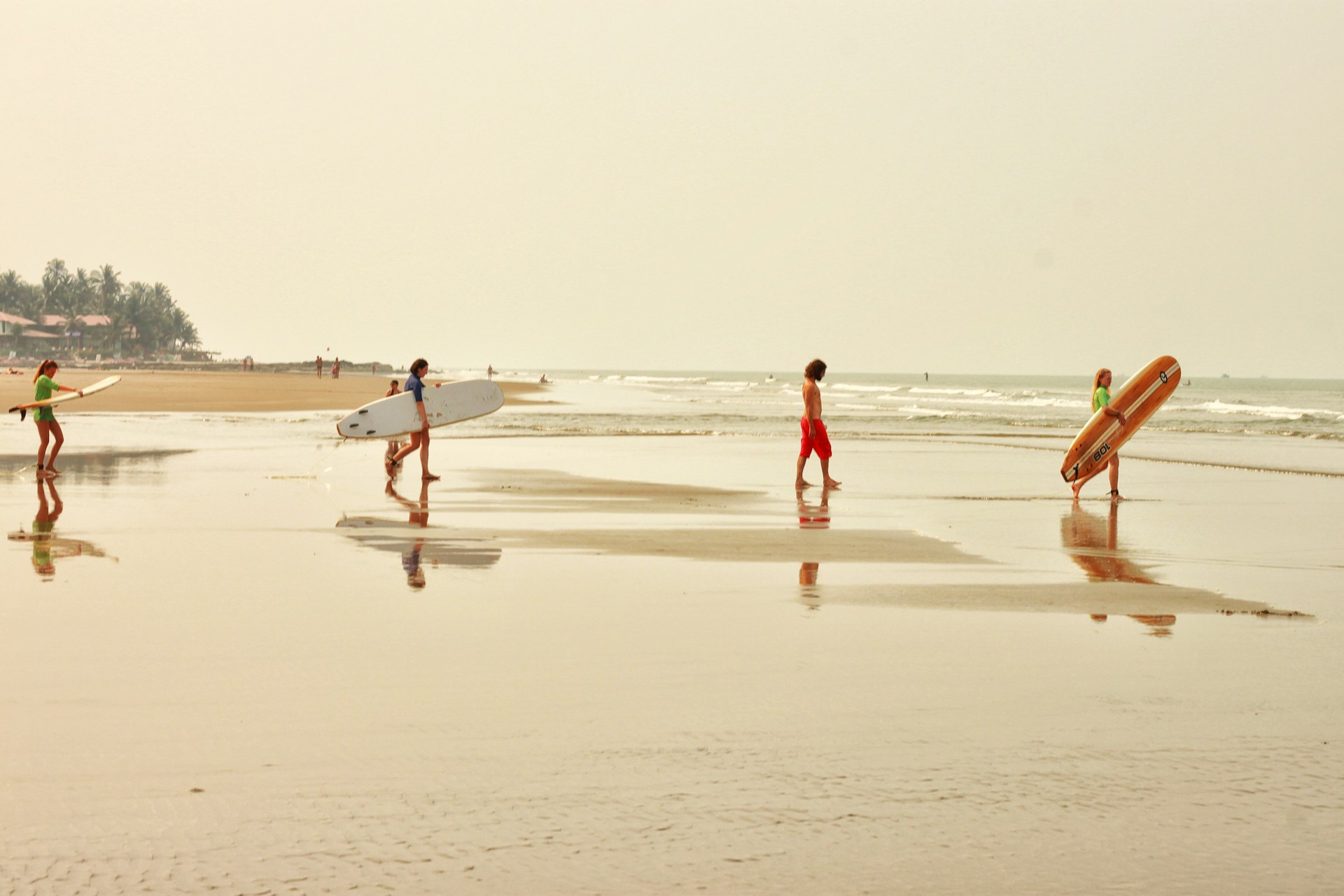 people walking on beach during daytime