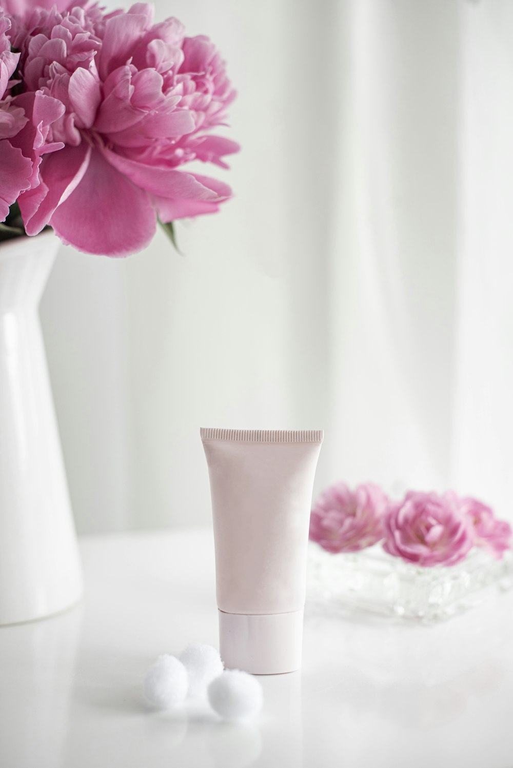 pink flower in white ceramic vase