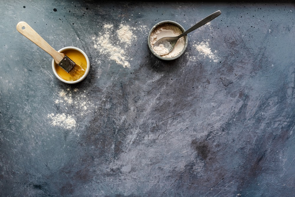 stainless steel spoon on round brown ceramic bowl