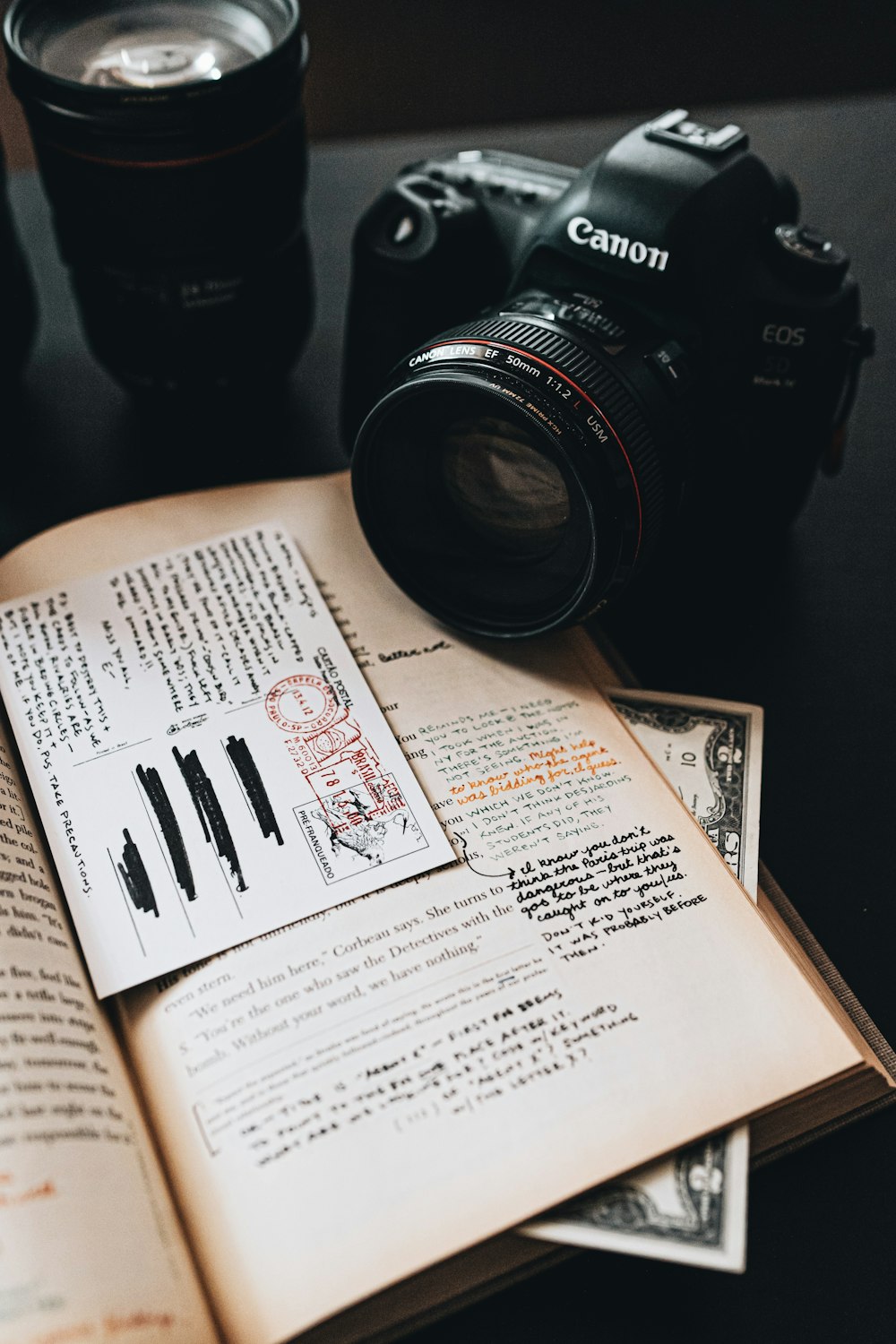 black nikon dslr camera on white book page