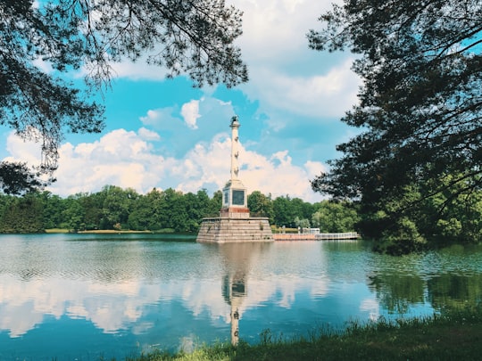 white concrete statue on body of water during daytime in Catherine Park Russia